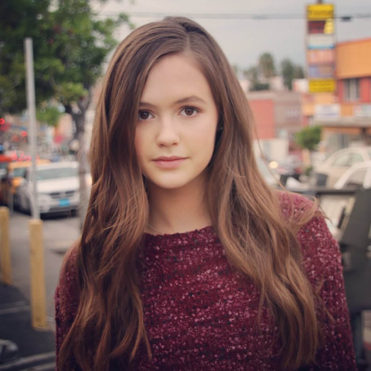 Olivia sanabia wearing purple sweater